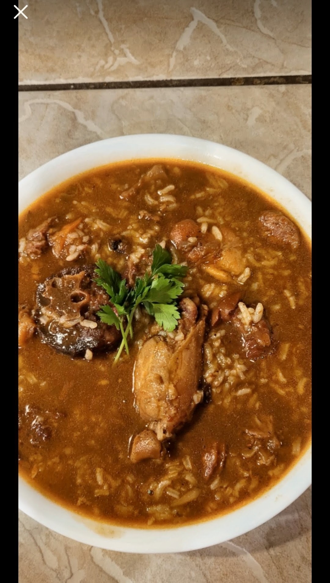 Hearty gumbo with chicken, sausage and rice in a rich broth