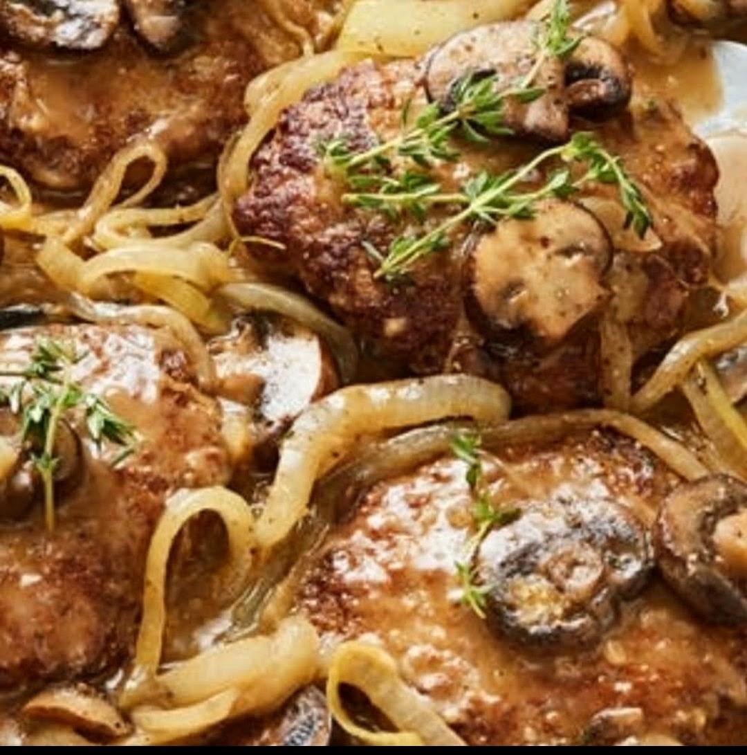 Smothered steak medallions with mushrooms, onions and gravy