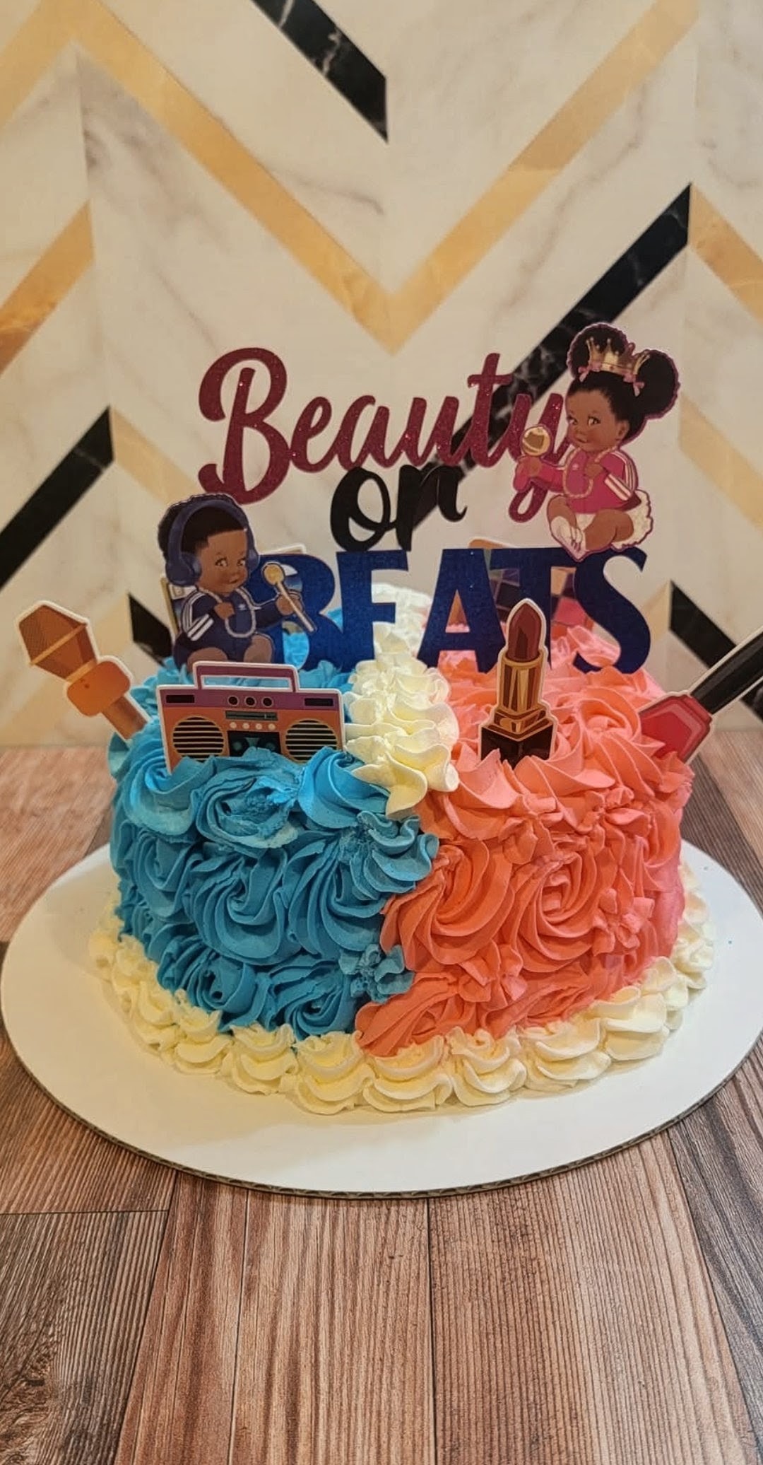Beautiful on Beats music themed birthday cake with split turquoise and coral rosettes