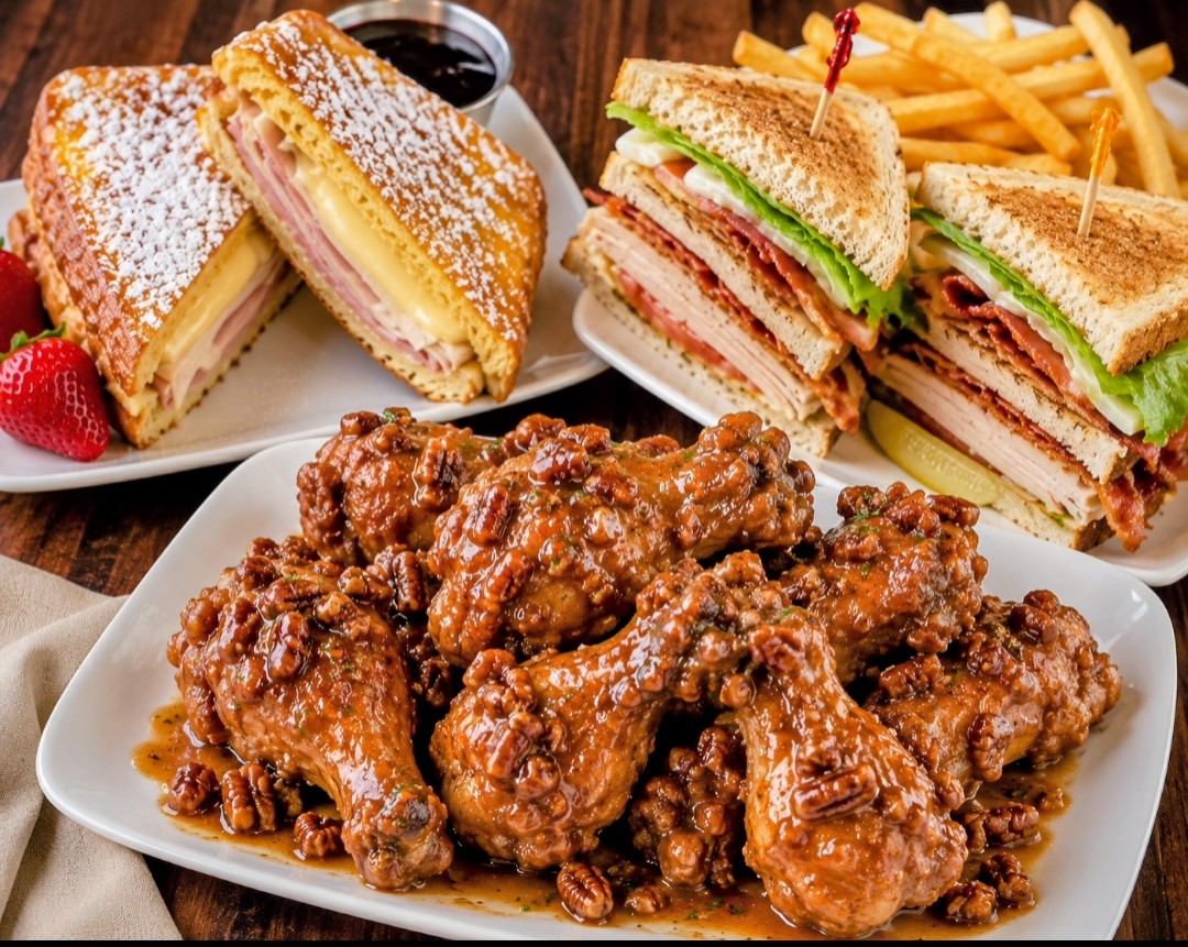 Angell's menu spread with Monte Cristo, club sandwich, pecan chicken and fries