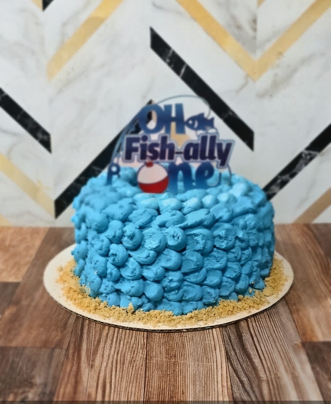 Oh Fish-ally One fishing themed first birthday cake with blue buttercream