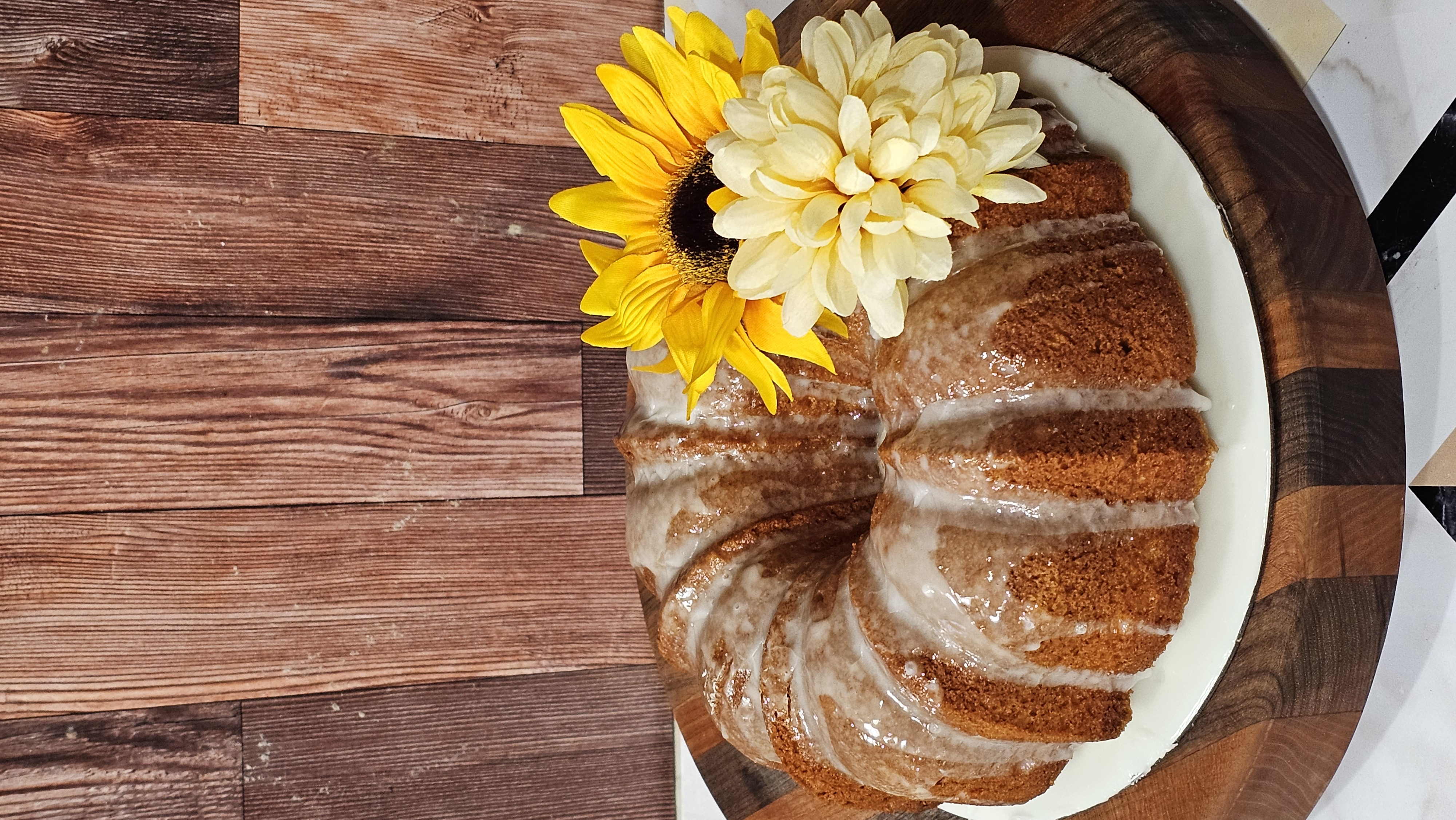 Glazed bundt cake with fresh sunflowers